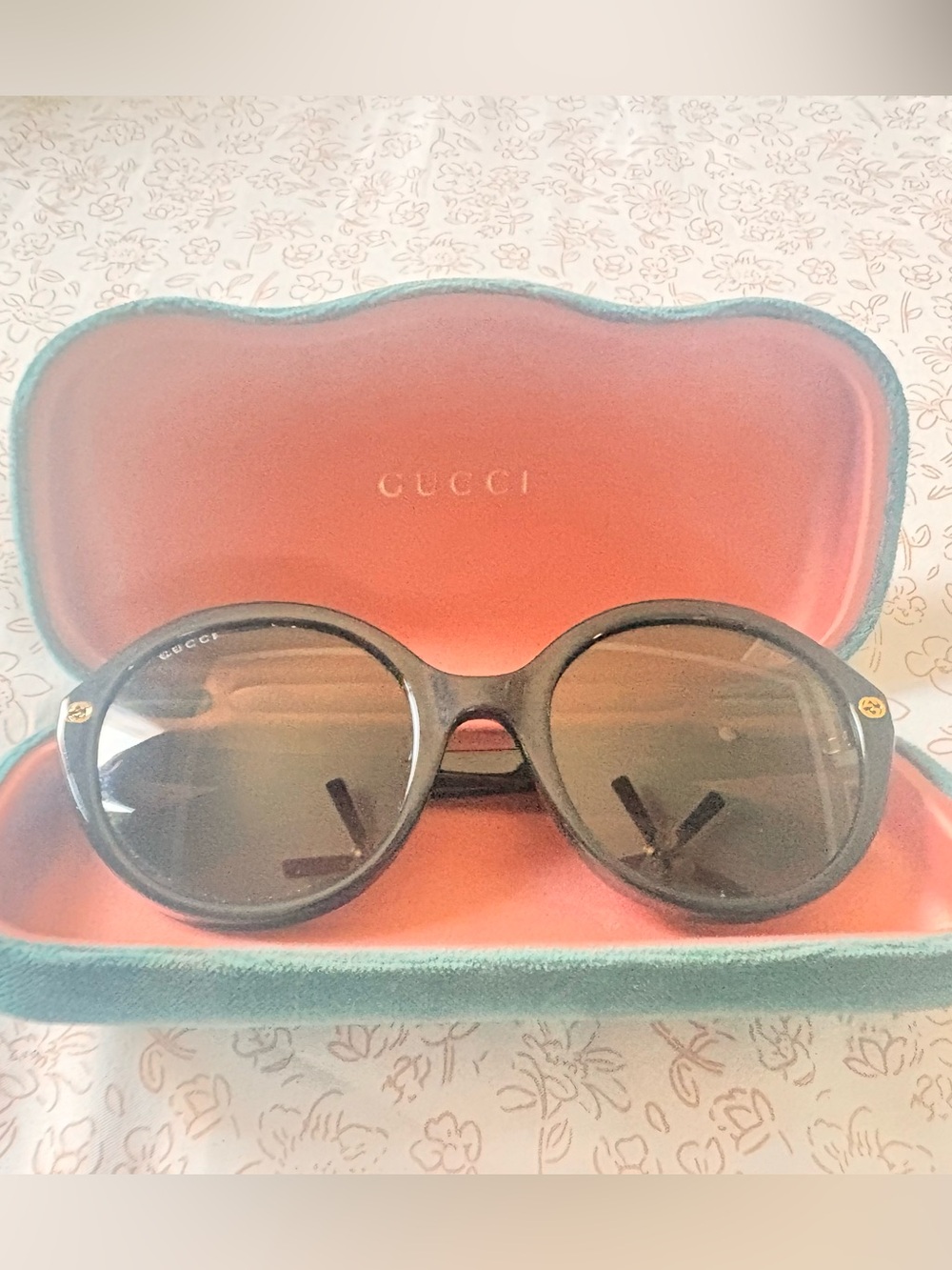 Gucci Black Round Sunglasses with Gold Logo Accents